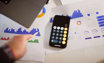 phone on desk with infographics