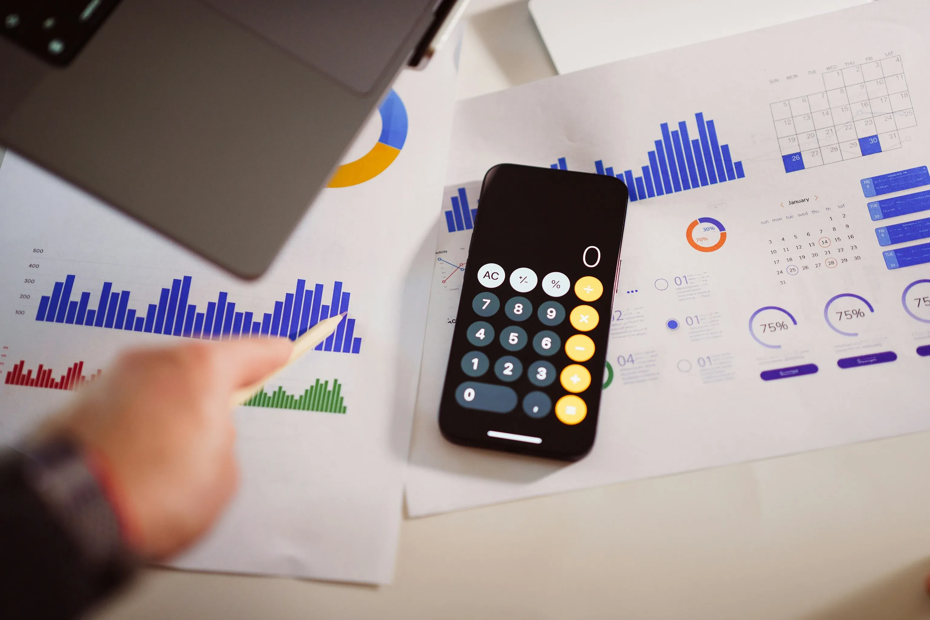 phone on desk with infographics